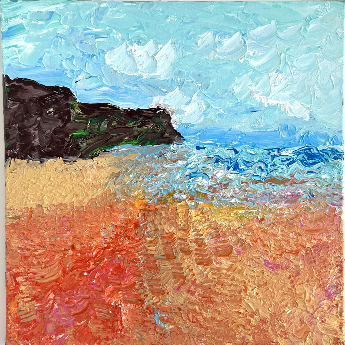 A textured seascape: pale blue sky, a dark rocky headland, blue water, and warm sand in thick, expressive strokes.